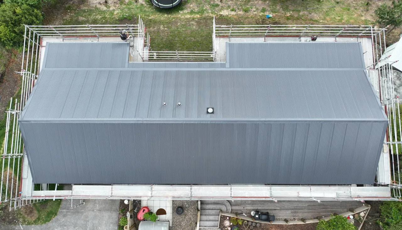 aerial view of a grey standing-seam metal roof