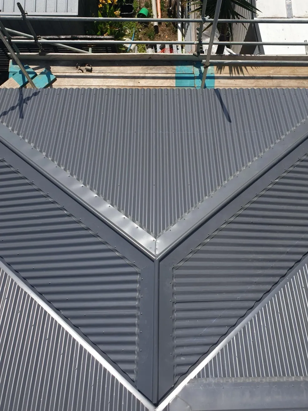 aerial of a complex metal roof with clean valleys